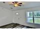 Bright living room featuring laminate floors, modern ceiling fan and a window view at 3 Dogwood Drive Loop, Ocala, FL 34472