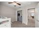 Bedroom featuring a ceiling fan, a closet, a bunkbed, and a gray dresser at 5537 Se 91St Pl, Ocala, FL 34480