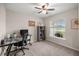 Office space featuring a large desk, bookshelves, a comfortable chair, and a window with natural light at 5537 Se 91St Pl, Ocala, FL 34480