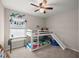 Bright bedroom with a bunk bed, a desk near the window, and a ceiling fan at 5537 Se 91St Pl, Ocala, FL 34480