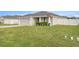 Exterior view of a single-Gathering home with a well-manicured lawn and attached garage at 5537 Se 91St Pl, Ocala, FL 34480