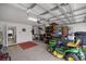 A spacious two car garage for storage with an open entryway to the home's interior at 5537 Se 91St Pl, Ocala, FL 34480