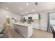 An open kitchen with stainless steel appliances and a view of the living room at 5537 Se 91St Pl, Ocala, FL 34480