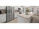 Stainless steel refrigerator, modern appliances, white cabinets, and granite countertops in the kitchen at 5537 Se 91St Pl, Ocala, FL 34480