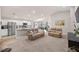 Open-concept living area with modern furniture and stainless steel appliances at 5537 Se 91St Pl, Ocala, FL 34480
