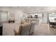 Inviting living space featuring a kitchen with white cabinets and dining area at 5537 Se 91St Pl, Ocala, FL 34480