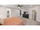 Large bedroom features a ceiling fan, walk-in closet, and ensuite bathroom for added privacy at 5537 Se 91St Pl, Ocala, FL 34480