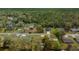 Charming neighborhood aerial view with tree-lined streets and well-maintained homes in a serene setting at 6718 Cherry Rd, Ocala, FL 34472