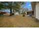 View of backyard showing storage shed and screened in patio at 6718 Cherry Rd, Ocala, FL 34472
