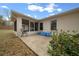 View of backyard patio showing access to the screened in porch at 6718 Cherry Rd, Ocala, FL 34472