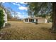 View of backyard showing screened in patio at 6718 Cherry Rd, Ocala, FL 34472