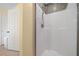 Bathroom with a walk-in shower, tiled walls, and well-lit area, ready for relaxation at 6718 Cherry Rd, Ocala, FL 34472
