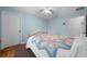 Bedroom featuring a hardwood bed frame, carpet, and an entrance to an adjacent room at 6718 Cherry Rd, Ocala, FL 34472
