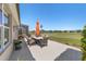 Back porch with table and chairs overlooking the golf course at 6865 Sw 97Th Terrace Rd, Ocala, FL 34481