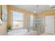 A view of the bathtub and shower in the bathroom at 6865 Sw 97Th Terrace Rd, Ocala, FL 34481