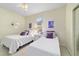 Bedroom with two twin beds and a window at 6865 Sw 97Th Terrace Rd, Ocala, FL 34481