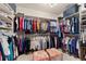 Spacious walk-in closet with custom shelving and ample storage for clothes and accessories at 6865 Sw 97Th Terrace Rd, Ocala, FL 34481