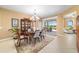 Elegant dining room with patio access and a china cabinet at 6865 Sw 97Th Terrace Rd, Ocala, FL 34481