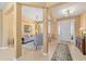 Bright foyer with tile flooring, white front door, and views of the living room and formal entry at 6865 Sw 97Th Terrace Rd, Ocala, FL 34481