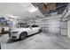 Spacious two car garage featuring overhead storage at 6865 Sw 97Th Terrace Rd, Ocala, FL 34481
