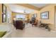 Comfortable living area with natural light, relaxed seating, and seamless integration with dining space at 6865 Sw 97Th Terrace Rd, Ocala, FL 34481