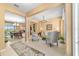 Elegant living room featuring neutral tones, tile floors, and an open concept design at 6865 Sw 97Th Terrace Rd, Ocala, FL 34481
