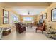 Spacious living room with comfortable seating, bright natural light, and an open layout at 6865 Sw 97Th Terrace Rd, Ocala, FL 34481