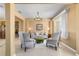 Charming living room featuring neutral decor, tile floors, and large windows at 6865 Sw 97Th Terrace Rd, Ocala, FL 34481