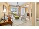 Inviting living room with neutral decor, ample natural light, and a view of the front entrance at 6865 Sw 97Th Terrace Rd, Ocala, FL 34481