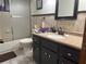 Bathroom featuring tile flooring, a vanity with a sink, and a shower/tub combo at 9140 Sw 103Rd Ln, Ocala, FL 34481