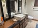 Bathroom with a modern vanity, square sink, decorative mirrors, and tile flooring at 9140 Sw 103Rd Ln, Ocala, FL 34481