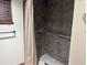 Neutral bathroom featuring tile floors and tiled shower with grab bars at 9140 Sw 103Rd Ln, Ocala, FL 34481