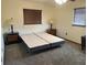 Bedroom showcasing neutral walls, carpeted floor, and ambient lighting at 9140 Sw 103Rd Ln, Ocala, FL 34481