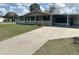 Charming single-story home features a covered porch, picket fence, and well-maintained lawn at 9140 Sw 103Rd Ln, Ocala, FL 34481