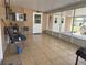 Enclosed patio with tile flooring, offering additional living space at 9140 Sw 103Rd Ln, Ocala, FL 34481