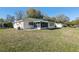 View of the backyard, showing the back of the house and the patio at 9581 Sw 85Th Ave # D, Ocala, FL 34481