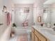 Bright bathroom featuring tub with shower, and light-colored vanity with white countertop at 9581 Sw 85Th Ave # D, Ocala, FL 34481