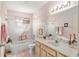 Well-lit bathroom with light-colored vanity, white countertop, tub and shower combination at 9581 Sw 85Th Ave # D, Ocala, FL 34481
