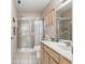 Cozy bathroom features a shower and a light wood vanity with a white countertop and single sink at 9581 Sw 85Th Ave # D, Ocala, FL 34481