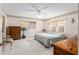 Serene bedroom with neutral tones, ceiling fan, and dresser at 9581 Sw 85Th Ave # D, Ocala, FL 34481