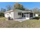 Exterior of home with a small back porch and an AC unit at 9581 Sw 85Th Ave # D, Ocala, FL 34481