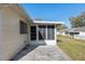 Exterior of home with a small back porch and a concrete backyard at 9581 Sw 85Th Ave # D, Ocala, FL 34481