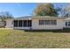 Exterior of home with a back patio and lawn at 9581 Sw 85Th Ave # D, Ocala, FL 34481