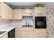 Well-equipped kitchen featuring a smooth cooktop, built-in oven, and ample storage space at 9581 Sw 85Th Ave # D, Ocala, FL 34481