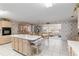 Open-concept kitchen featuring an island with bar stools, perfect for casual dining and entertaining at 9581 Sw 85Th Ave # D, Ocala, FL 34481
