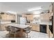 Spacious kitchen featuring an island with bar seating, ample counter space and white tile flooring at 9581 Sw 85Th Ave # D, Ocala, FL 34481