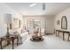 Cozy living room with plush carpeting, natural light, and stylish decor at 9581 Sw 85Th Ave # D, Ocala, FL 34481