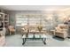 Comfortable living room featuring a sofa, accent chairs, and ample natural light at 9581 Sw 85Th Ave # D, Ocala, FL 34481