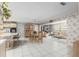 Open-concept living space featuring a dining area, breakfast bar and cozy sitting area with floral wallpaper at 9581 Sw 85Th Ave # D, Ocala, FL 34481