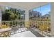Charming front porch with ample seating and views of the landscaped front yard at 9581 Sw 85Th Ave # D, Ocala, FL 34481
